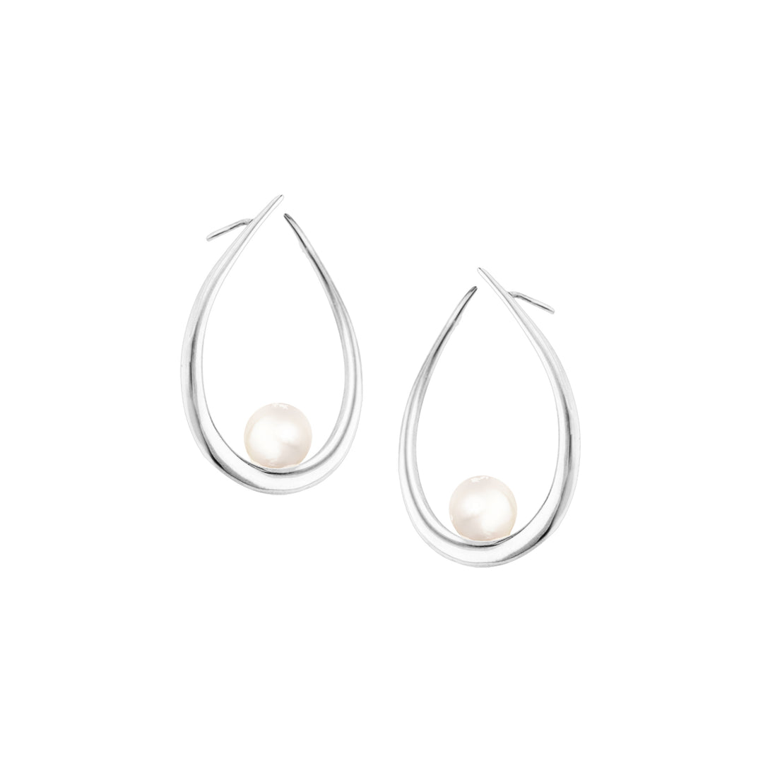Discover the timeless elegance of Daeira Pearl Earrings from Haniotis Hellas. Handcrafted in Greece, these sterling silver earrings adorned with a natural white freshwater pearl capture the essence of Greek mythology and the Aegean Sea. Versatile and ethically sourced, they are a perfect pairing with our Galene Pearl Ring. Embrace sophistication and elevate your style with Haniotis Hellas jewelry