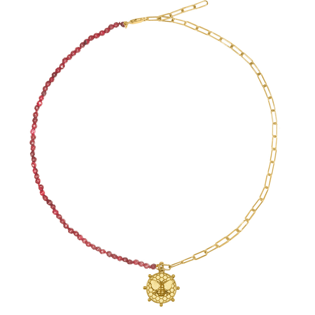 Bee charm with Ruby chain Each chain in our collection is meticulously crafted using only the finest materials, ensuring durability, longevity, and a dazzling shine. The striking combination of gold and precious stones creates a captivating allure that will complement any outfit you choose to pair it with.