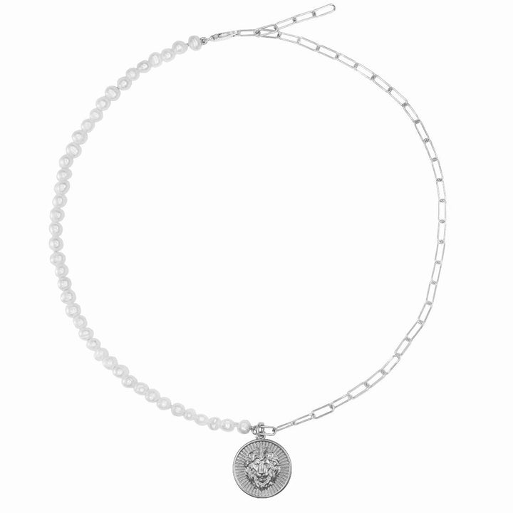 Lion Charm with Freshwater pearls. Discover strength and symbolism with the Lion Symbol Charm from Haniotis Hellas' Mythic Treasures collection. Crafted in Athens, Greece, this Sterling silver charm features a lion representing power, while the stars, crescent moon, and evil eye signify new beginnings and protection. Combine it with other collection charms for a unique and captivating look."