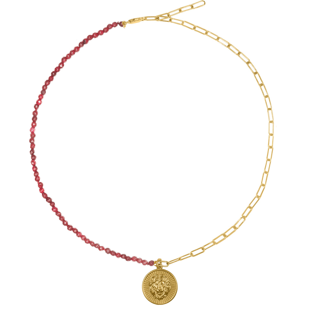 Lion charm in Gold 14 K with Ruby chain. Discover strength and symbolism with the Lion Symbol Charm from Haniotis Hellas' Mythic Treasures collection. Crafted in Athens, Greece, this 14K gold charm features a lion representing power, while the stars, crescent moon, and evil eye signify new beginnings and protection. Combine it with other collection charms for a unique and captivating look."